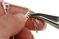 Pliers hanging chain onto component